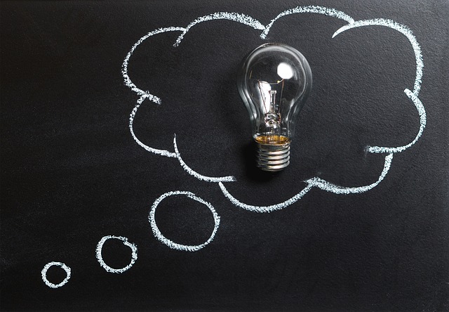 thought bubble, with an unlit lightbulb inside